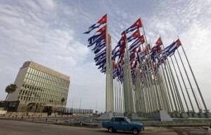 A car drives past the building of the the U.S. diplomatic mission in Cuba, The U.S. Interests Section, (USINT), in Havana,  September 12, 2013.  REUTERS/Desmond Boylan