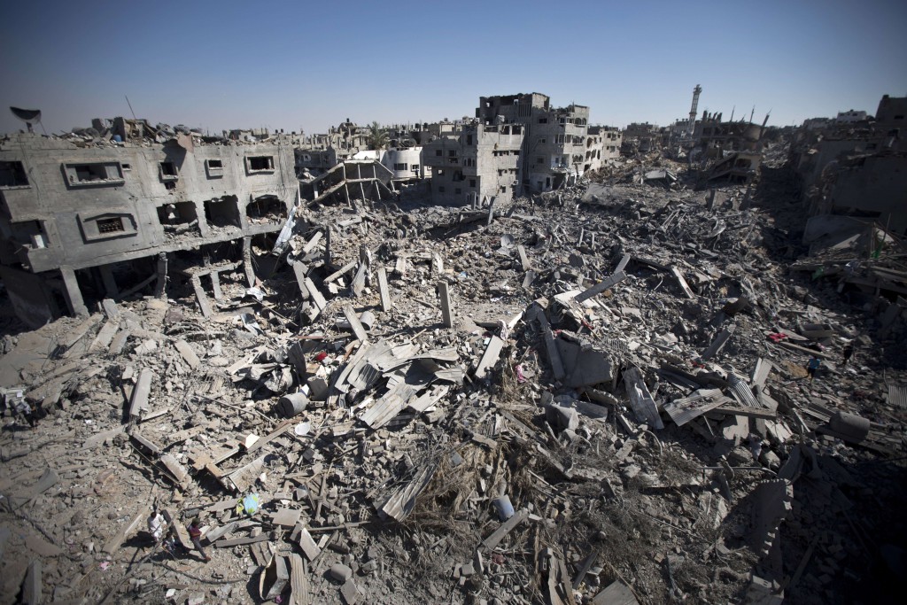 TOPSHOTS A picture taken on July 26, 2014 shows the rubble of destroyed buildings and homes in the Shejaiya residential district of Gaza City, as families returned to find their homes ground into rubble by relentless Israeli tank fire and air strikes. The death toll in Gaza soared to more than 1,000 as bodies were pulled from the rubble during a 12-hour truce top diplomats urged Israel and Hamas to extend. AFP PHOTO/MAHMUD HAMSMAHMUD HAMS/AFP/Getty Images